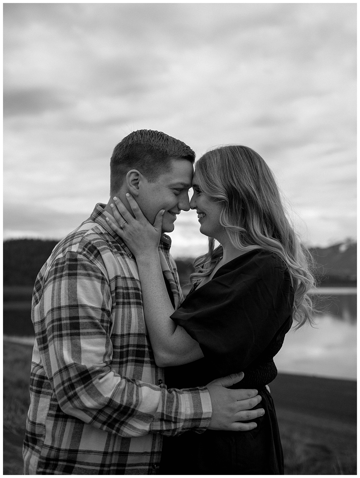 girl holds guy's face as they touch foreheads by Stephanie J. Zamora Photography