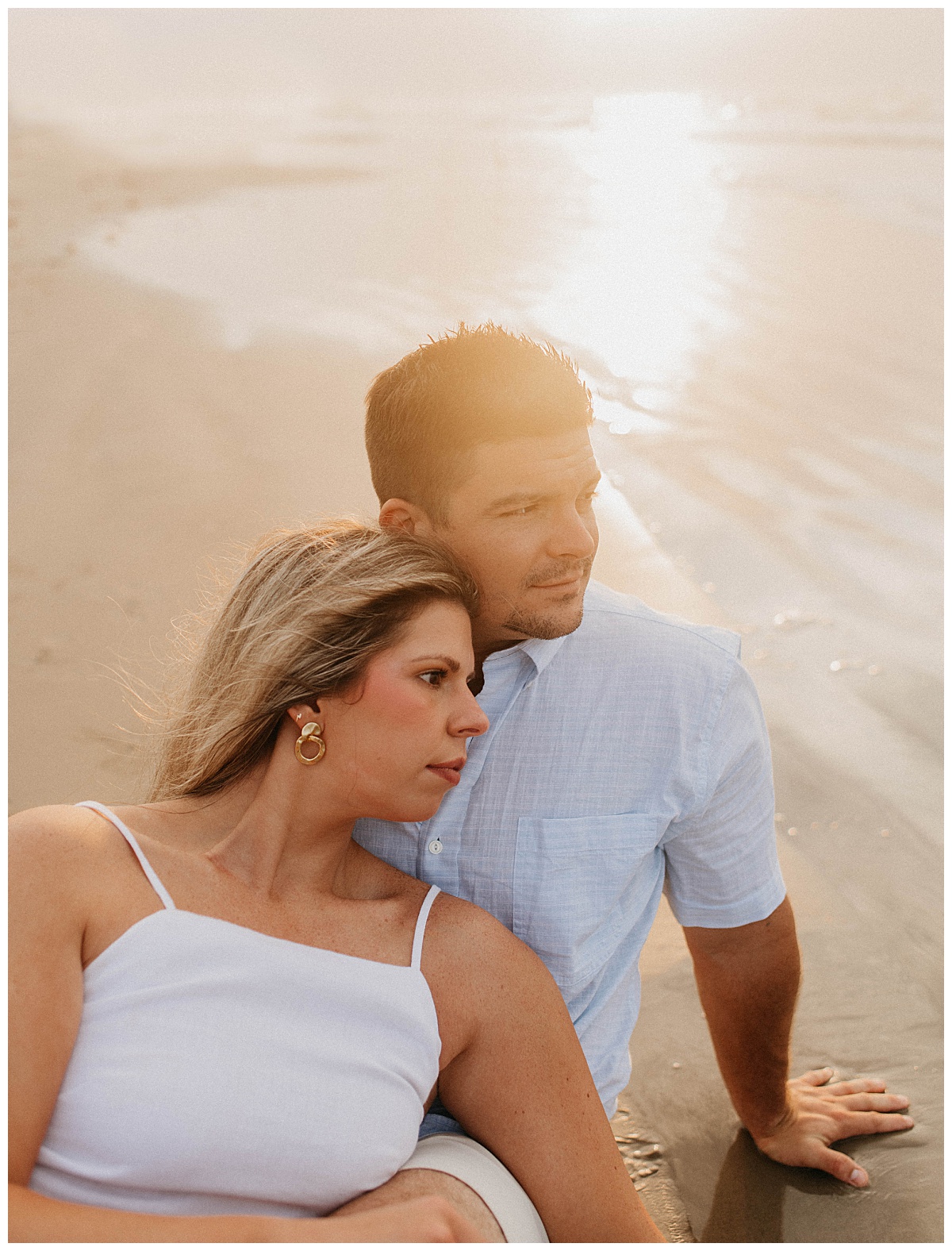 woman leans back against fiance's chest by Texas wedding photographer