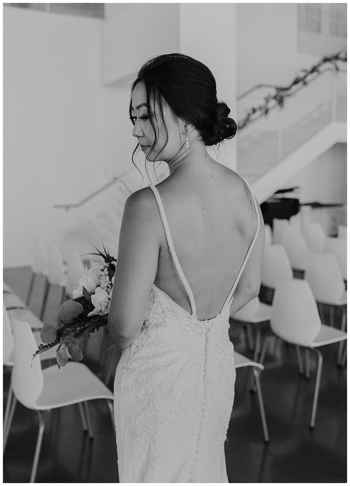 bride looks over her shoulder by Texas wedding photographer