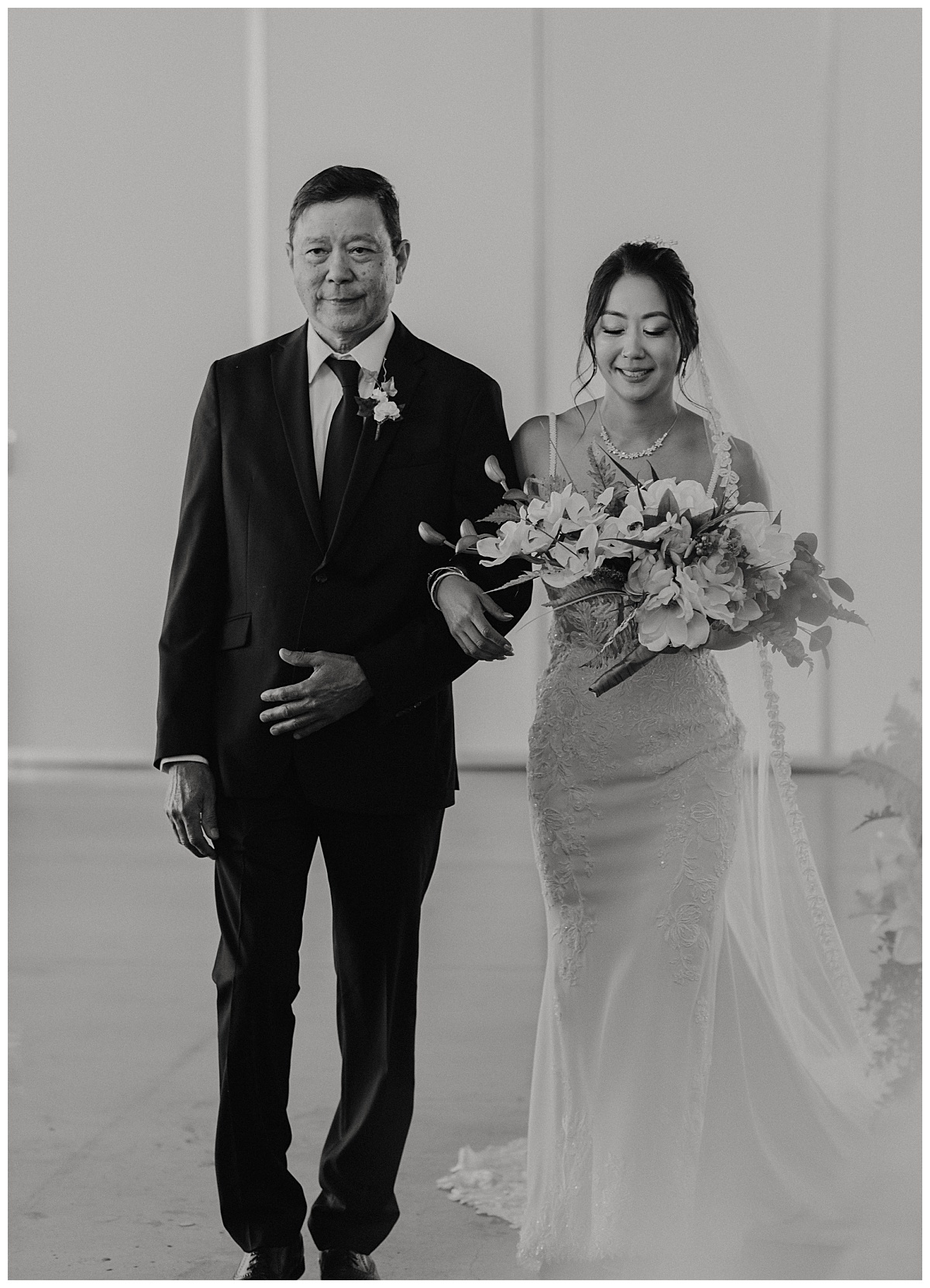 father of the bride walks his daughter down the aisle by Stephanie J Zamora Photography