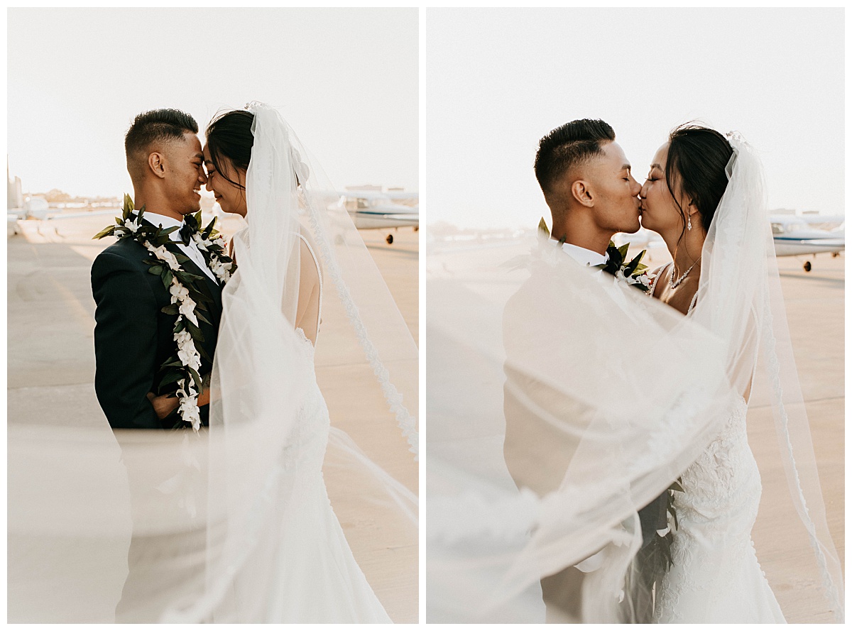 couple kisses on runway of airport during Long Beach ceremony 