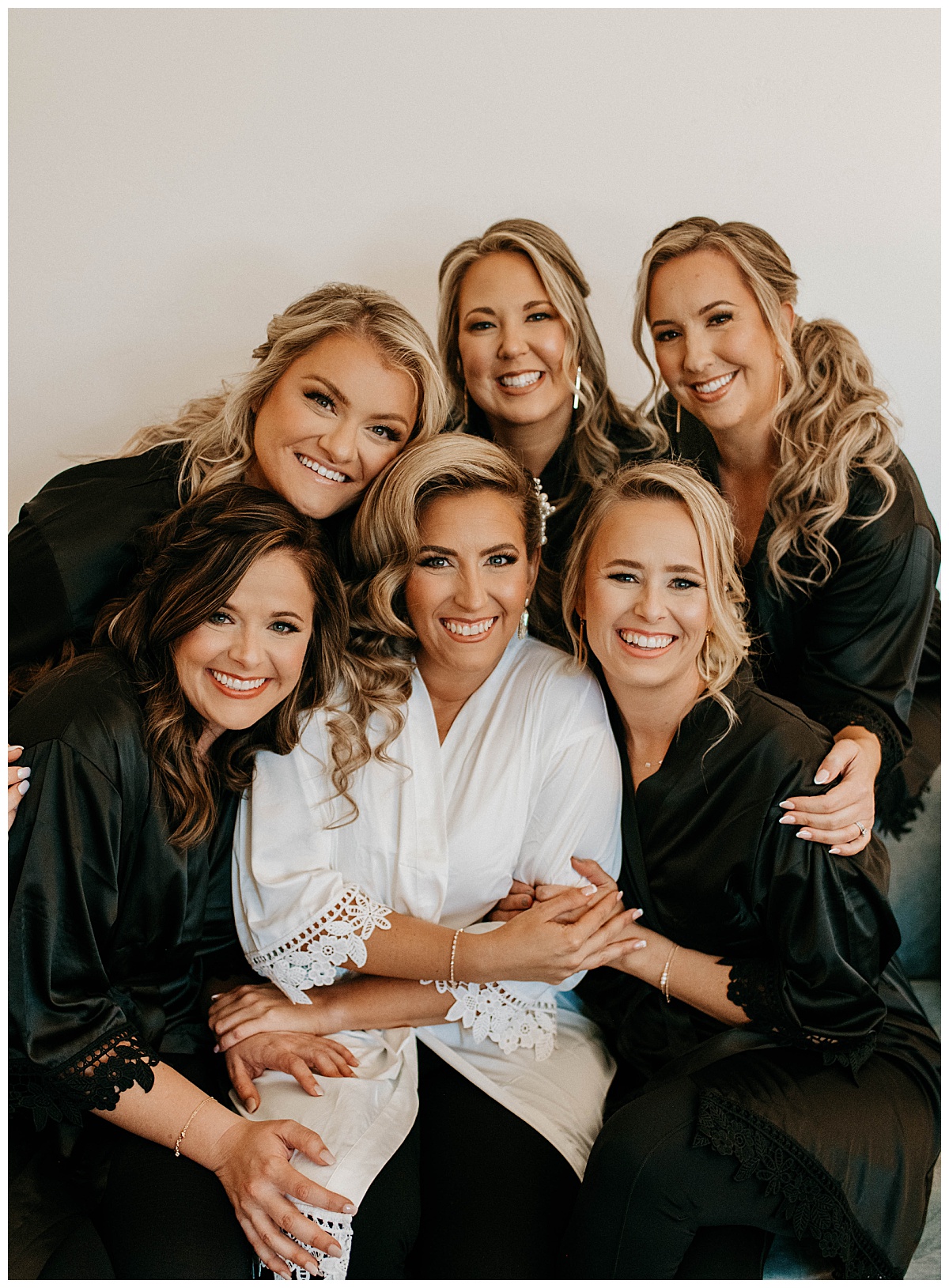 bridesmaids gather around bride during Posey Meadows ceremony