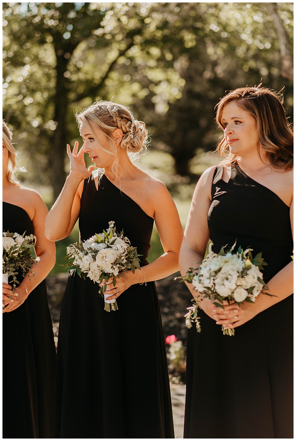 bridesmaid wipes her tears during Posey Meadows ceremony